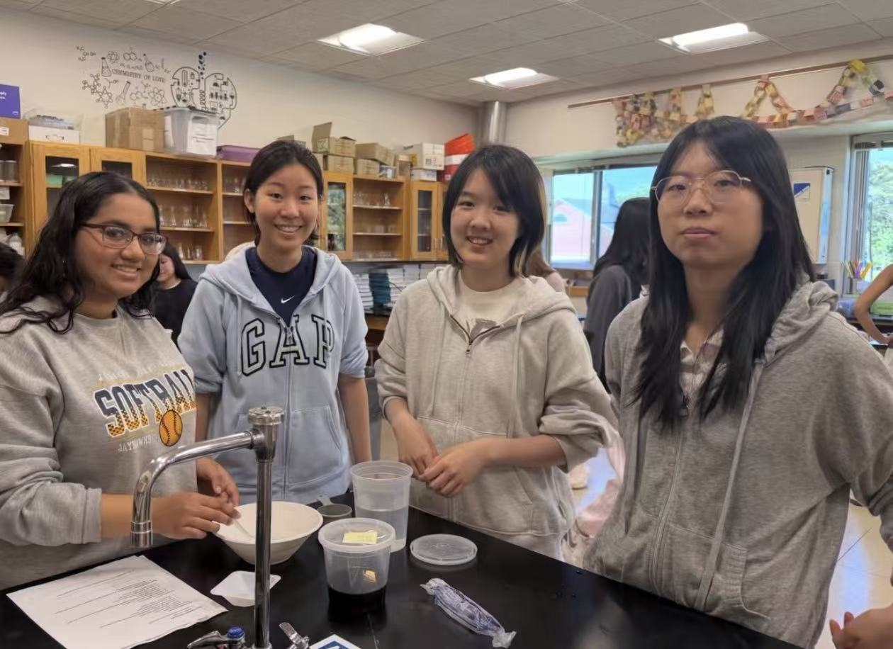 Young people collaborating in a science classroom