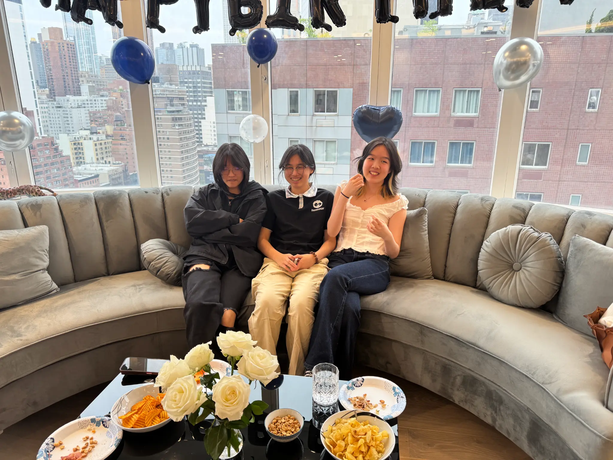 Three young people gathered in a city home