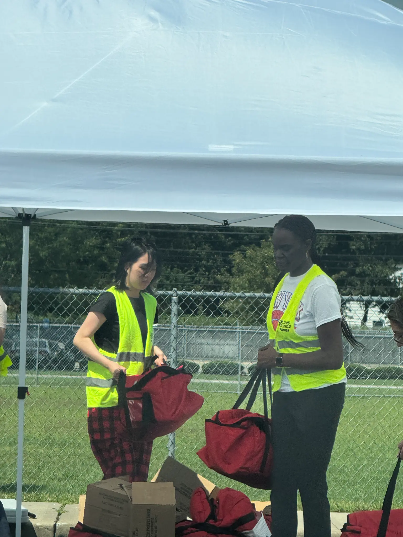Young volunteers preparing bags at a community service event