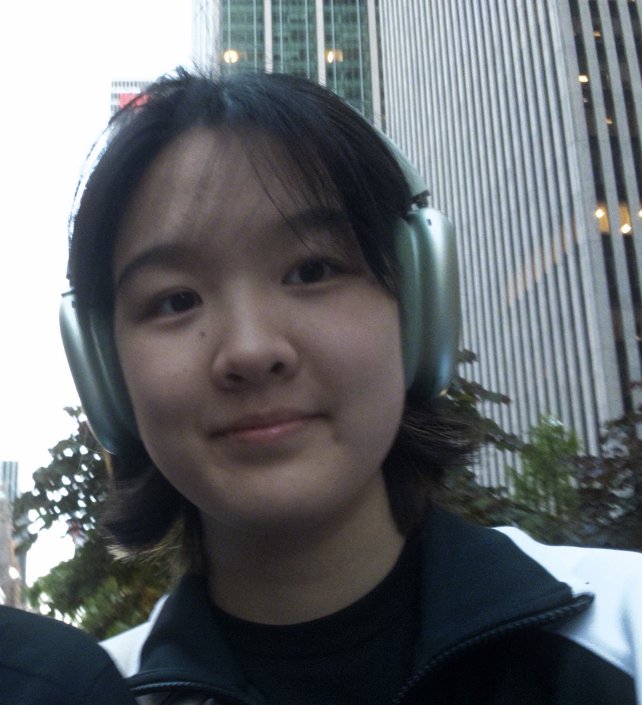 Quinn Zhang wearing headphones in the city
